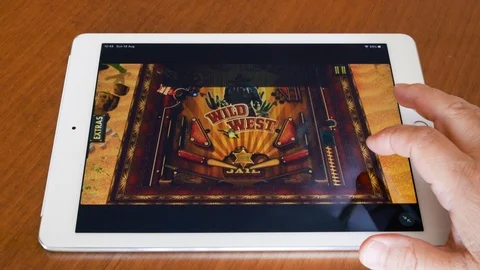 Playing Pinball arcade game on Apple Ipad Stock Footage 114328086