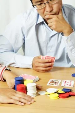 Playing poker Stock Photos