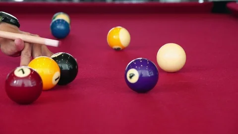 Playing the pool-billiard game on red baize table. This is sports. Stock Footage 83703775