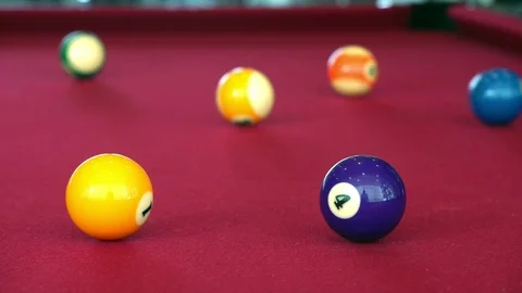 Playing the pool-billiard game on red baize table. This is sports. Stock Footage 83703822
