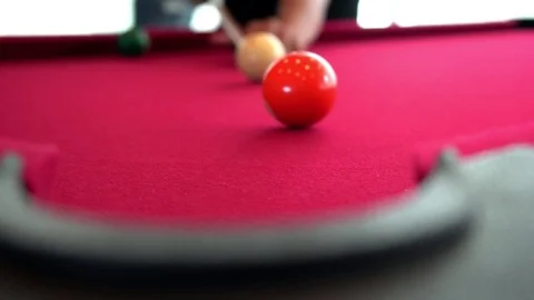 Playing the pool-billiard game on red baize table. This is sports. Stock Footage 83703844