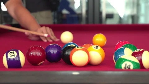 Playing the pool-billiard game on red baize table. This is sports. Stock Footage 83703859