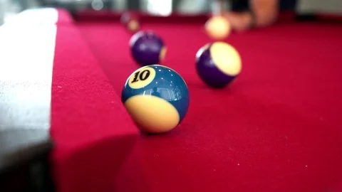 Playing the pool-billiard game on red baize table. This is sports. Stock Footage 83703862