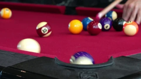 Playing the pool-billiard game on red baize table. This is sports. Stock Footage 83703880