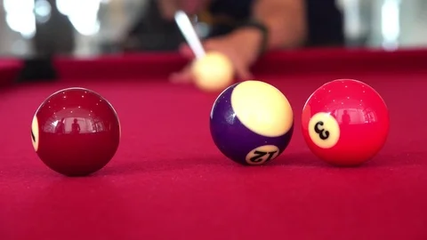 Playing the pool-billiard game on red baize table. This is sports. Stock Footage 83703892