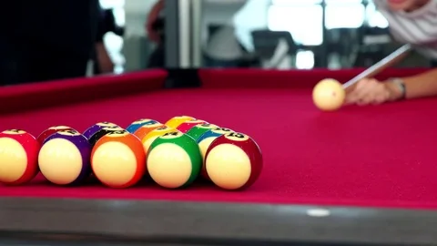 Playing the pool-billiard game on red baize table. This is sports. Stock Footage 83703902