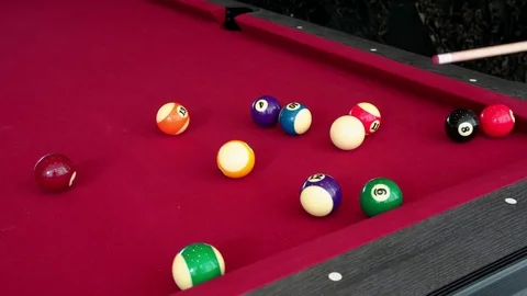 Playing the pool-billiard game on red baize table. This is sports. Stock Footage 83703937