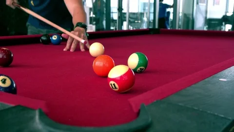 Playing the pool-billiard game on red baize table. This is sports. Stock Footage 83703958