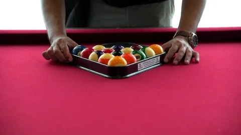 Playing the pool-billiard game on red baize table. This is sports. Video stock 83705296