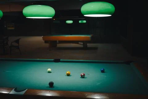 Playing pool in a night pub 스톡 사진