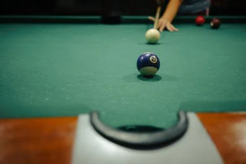 Playing pool in a night pub Stock Photos