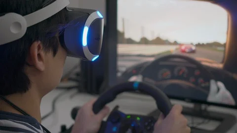 Playing racing video game with VR headset at home Stock Footage 86122288