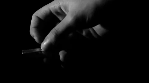 Playing with a razor blade Stock Footage 79667690