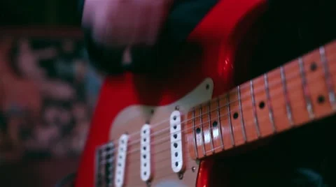 Playing a red guitar Stock Footage 51143246