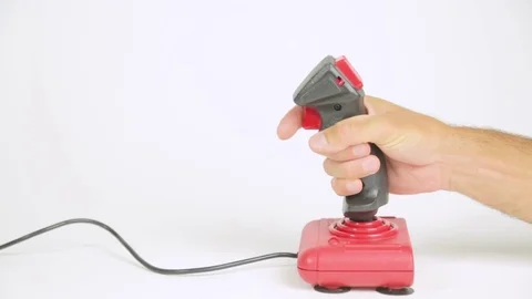 Playing with a red joystick Stock Footage 79101445