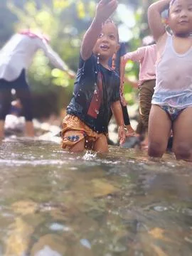 Playing in the river Foto stock