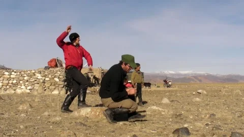 Playing a Rock-Throwing Game in Western Mongolia Stock Footage 234296294