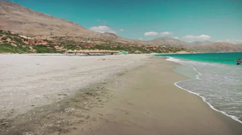 Playing with Sand and Waves on The Beach on a Summer Day Stock Footage 60383220