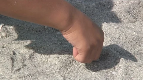 Playing in the sand Stock Footage 7747654