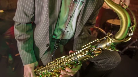 Playing a saxophone and being dressed in a nice outfit Stock Footage 112189547
