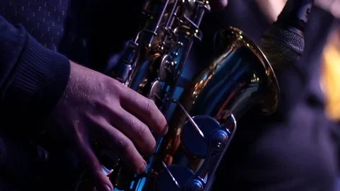 Playing the saxophone, hands running on the keys Stock Footage
