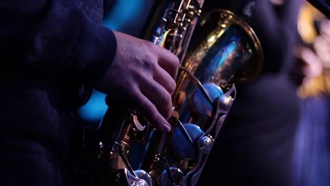 Playing the saxophone, hands running on the keys Stock Footage 122080241
