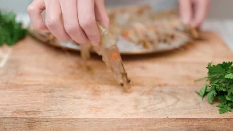 Playing with a shrimp/prawn, make it jump and dance in a funny way in 4K. Stock Footage 138285449