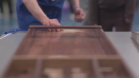 Playing Shuffelboard in Slow Motion Stock Footage 34318932