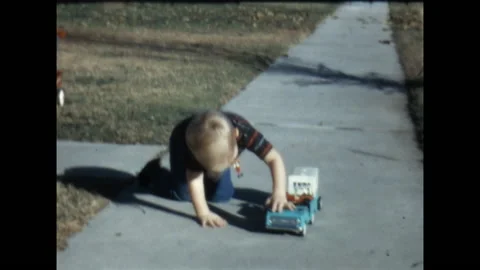 Playing on the Sidewalk 1967 Stock Footage 211886802