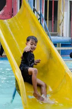 Playing on the slide Stock Photos