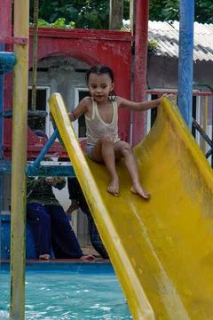 Playing on the slide Stock Photos
