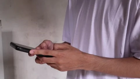 Playing smart-phone Stock Footage 259464220