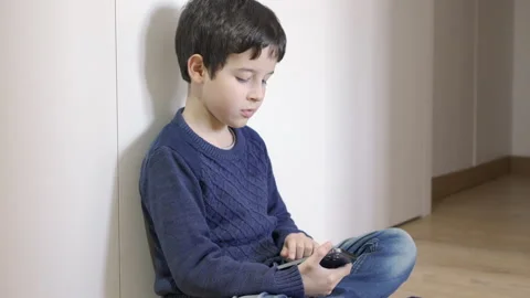 Playing with a smartphone Stock-Footage 265102452