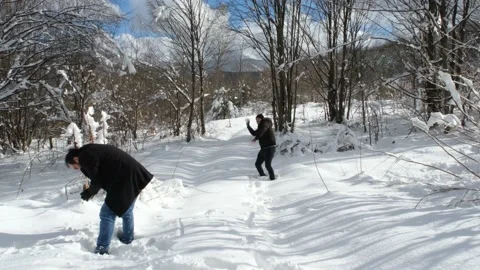 Playing snowballs in winter Stock Footage 168728556