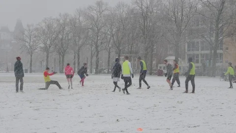 Playing Soccer in the Snow Stock Footage
