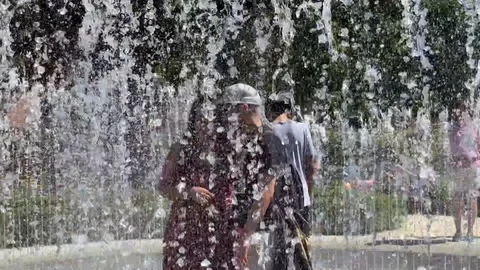 Playing in a Splash Pad Stock Footage 114231460