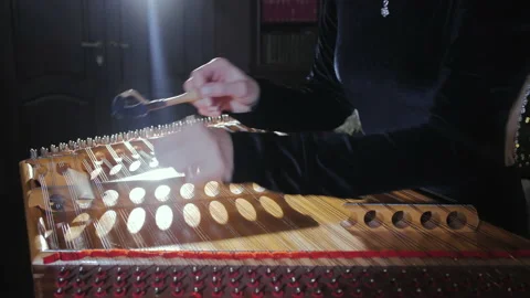 Playing a stringed instrument. Hammered dulcimer close up. Lens Flare. Stock Footage 145764876