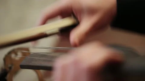 Playing strings of a Cello with fingers, close up Stock Footage 47727181