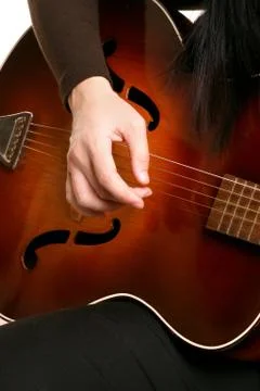 Playing strumming a guitar Foto stock