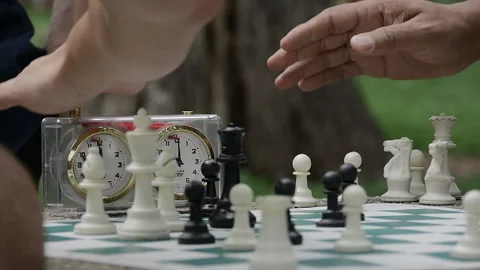 Playing super fast chess with timer clock Stock Footage 186175485