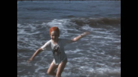 Playing in the Surf 1967 Stock Footage 211899225
