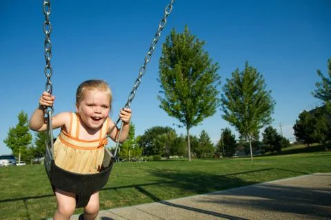Playing on the swing Stock Photos