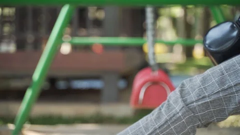 Playing swing playground at public park Video stock 127363214