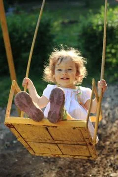 Playing on the swings Stock Photos