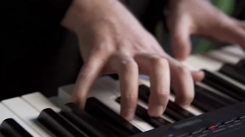 Playing on a synthesizer. close-up. macro Stock Footage 196155450