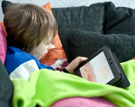 Playing on tablet Stock Photos