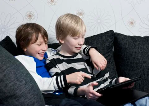 Playing with a tablet Stock Photos