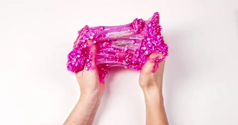 Playing with textured slime with bubbles, stretching the gooey substance for fun Vídeo Stock 139971261