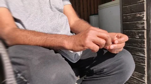 Playing with thread with both hands Stock Footage 301448274