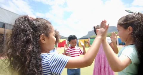 Playing together outside, group of school children enjoying recess activities Stock Footage 300328116